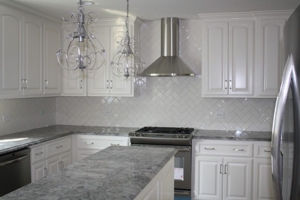 light grey kitchen cabinet with quartz countertops